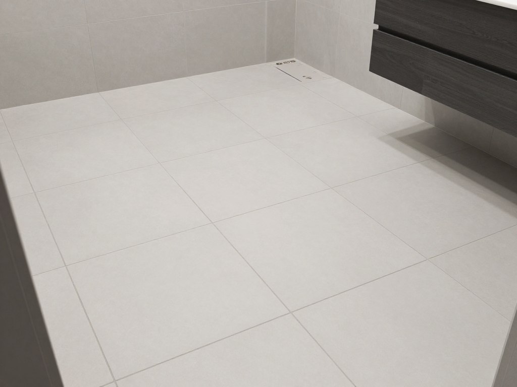 Fertig verlegte Bodenfliesen in modernem Badezimmer in Bremervörde